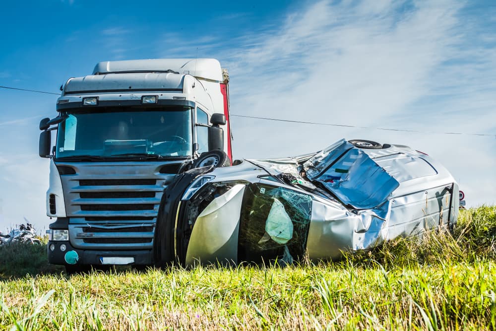 Truck collides with a car